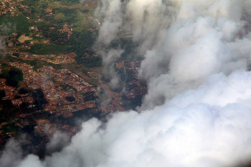 Cloud covers Jakarta, in a photograph from a Hercules plane being used for cloud seeding.