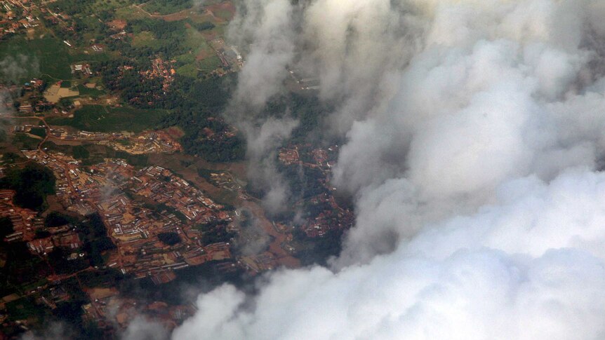 Cloud covers Jakarta, in a photograph from a Hercules plane being used for cloud seeding.