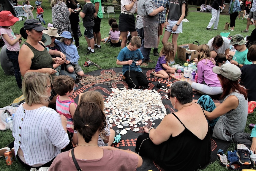 Children with adults taking part in craft making.