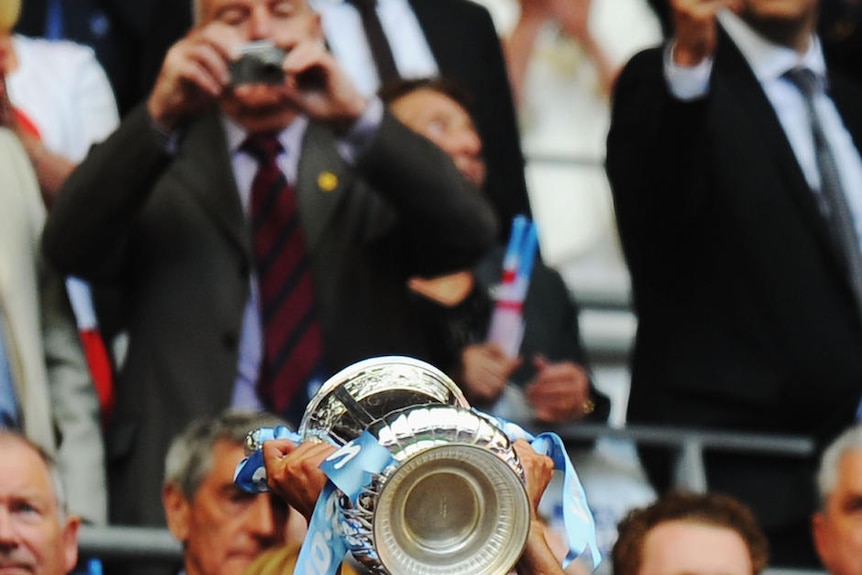 Tevez lifts the FA Cup