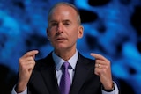 President, Chairman and CEO of The Boeing Company Dennis Muilenburg speaking at a conference