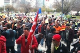 Union members protest outside court