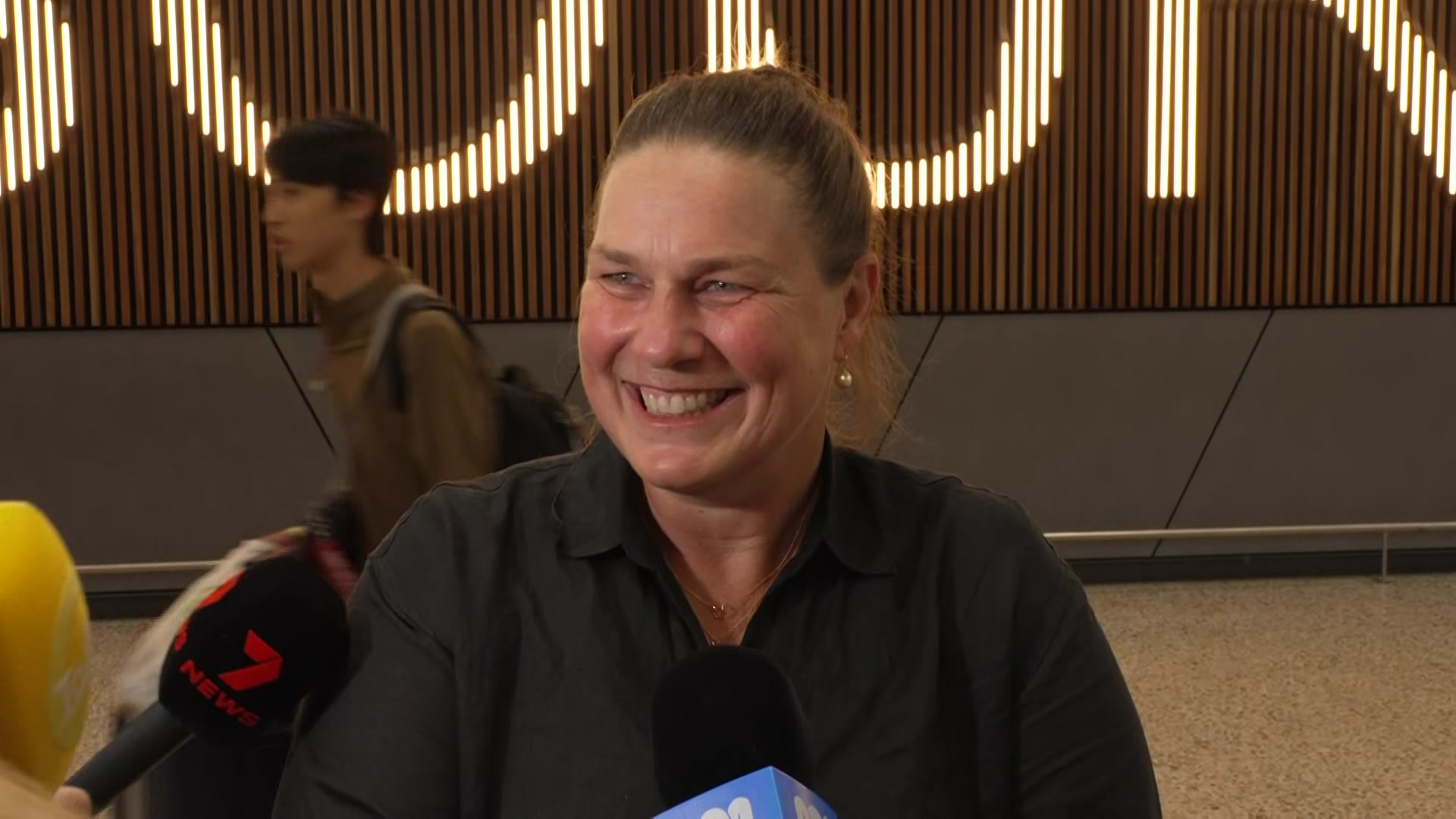 A smiling woman filled with royal pride.