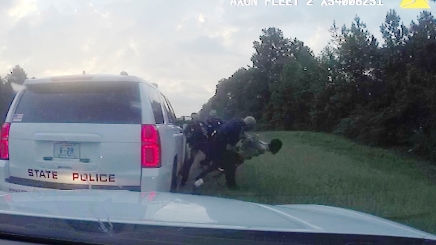 Louisiana police tackle Morgan Blake to the ground and arrest him