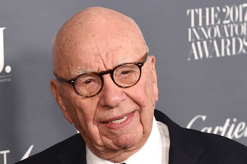 Media mogul Rupert Murdoch on a red carpet, close up of his smiling face