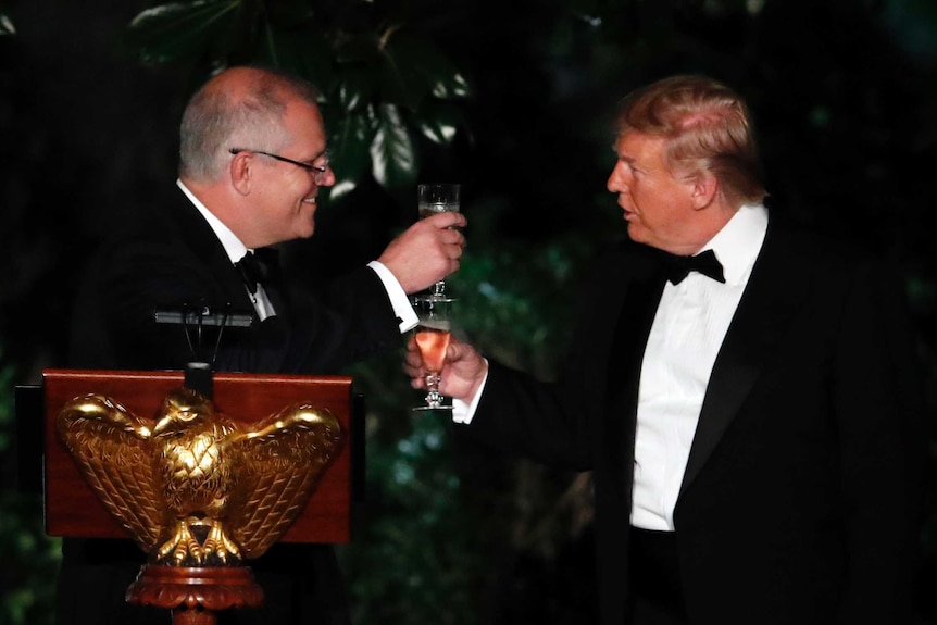 Donald Trump and Scott Morrison raise a glass to one another during the state dinner at the White House.