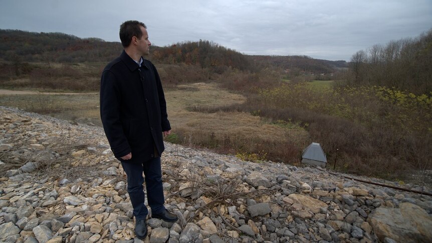 Nedzad Avdic looks out across the site of the Srebrenica massacre.