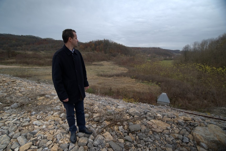 Nedzad Avdic looks out across the site of the Srebrenica massacre.