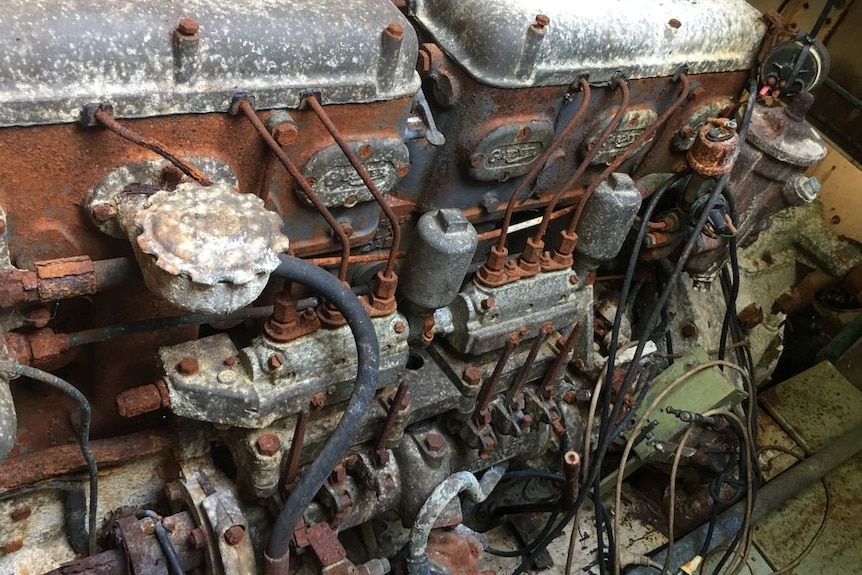 A rusty boat engine.