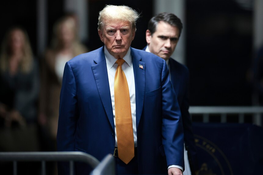 Former President Donald Trump followed his attorney Todd Blanche walking out of court