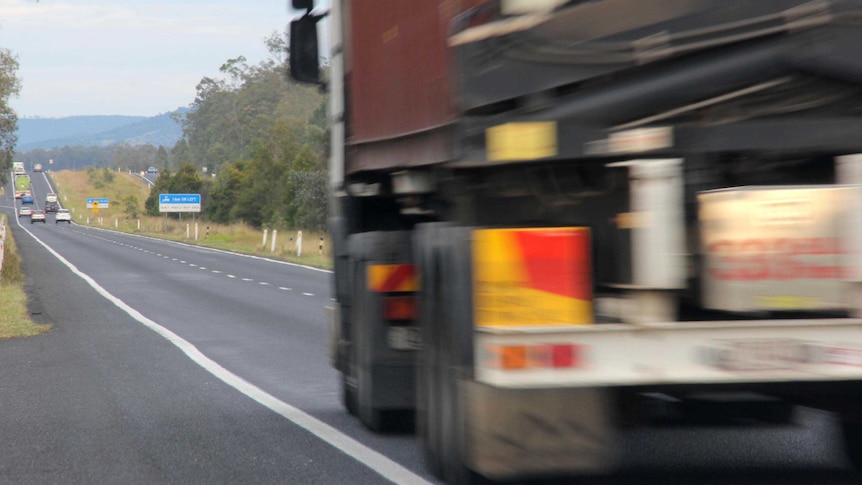 A truck travels along the Warrego Highway between Brisbane and Toowoomba.