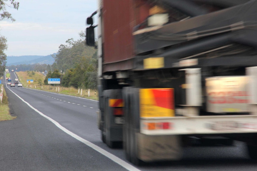 A truck travels along the Warrego Highway between Brisbane and Toowoomba.