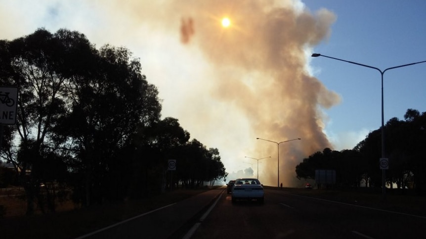Traffic stopped on the road due to a suspicious blaze in Belconnen.