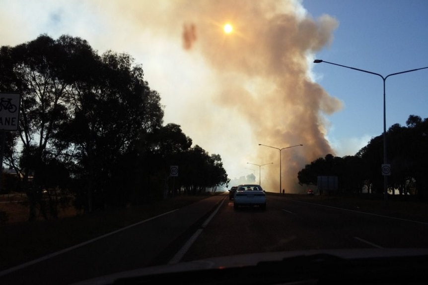 Traffic stopped on the road due to a suspicious blaze in Belconnen.