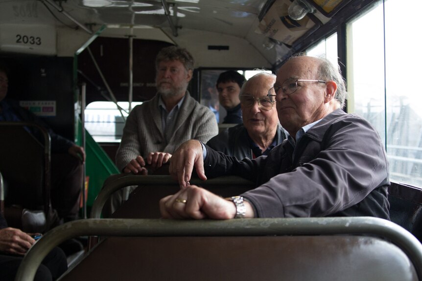 Passengers ride the vintage Leyland bus