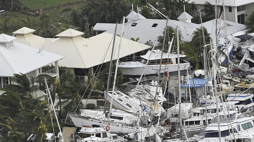 Boats piled on top of each other at the Port Hinchinbrook Marina on February 3, 2011.