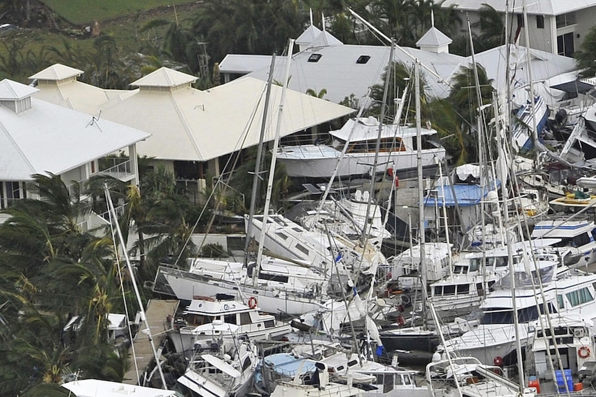 Boats piled on top of each other at the Port Hinchinbrook Marina.