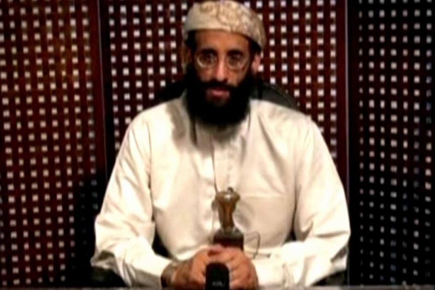 Anwar al-Awlaqi sits hands clasped in front of him