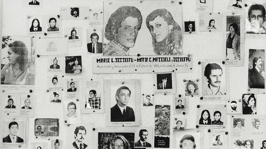 Black and white image of a wall of photos of young Argentinians who went missing during military dictatorship.