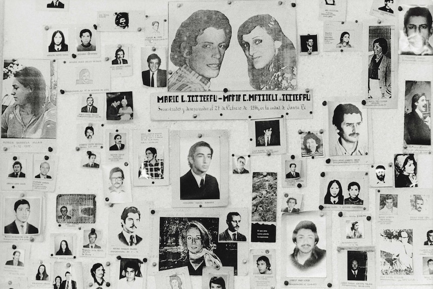 Black and white image of a wall of photos of young Argentinians who went missing during military dictatorship.