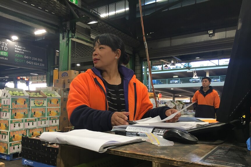 Theresa Nguyen is working at her stall in Sydney Markets.