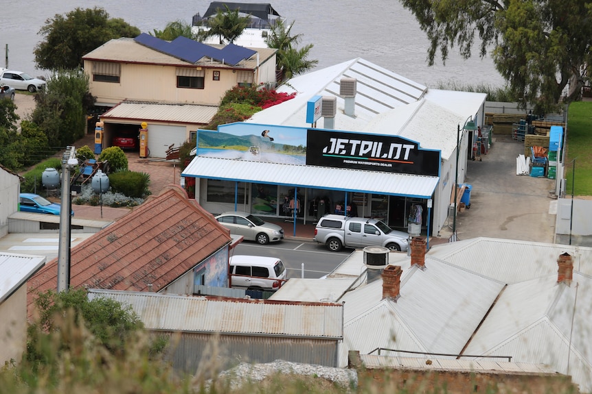 Shop with a river behind it.