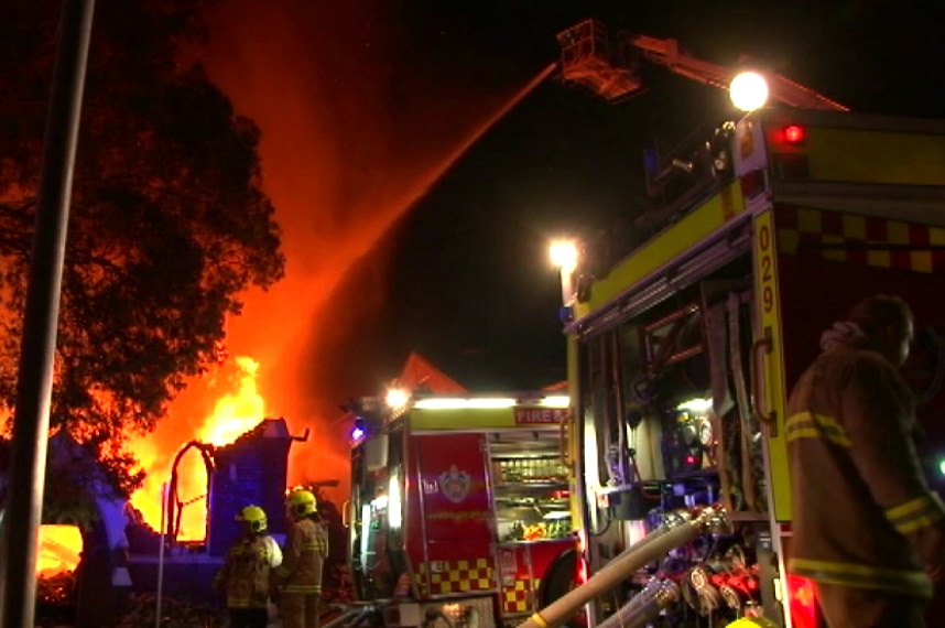 Large flames billow out of a church