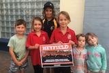 Heyfield children outside a meeting about the future of the town's sawmill.