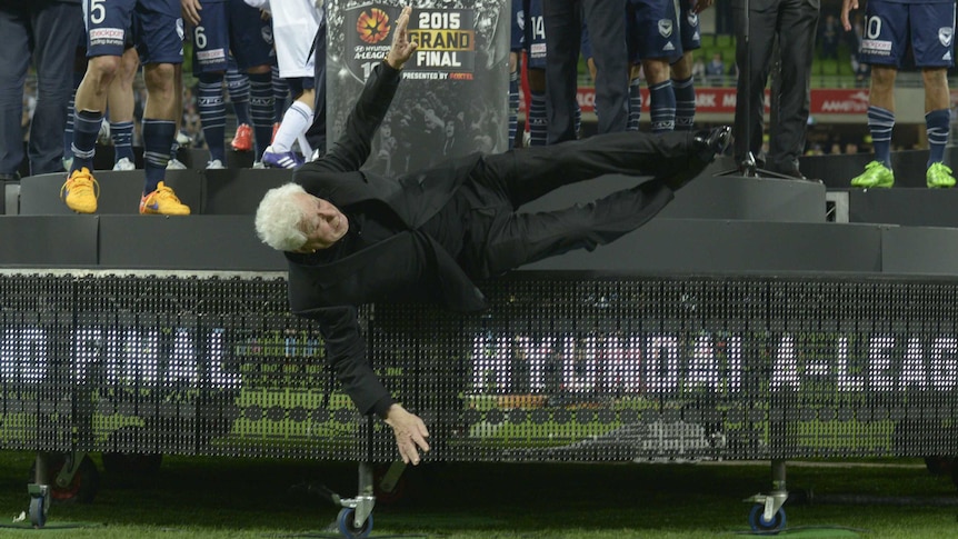 Frank Lowy falls off the stage at A-League grand final