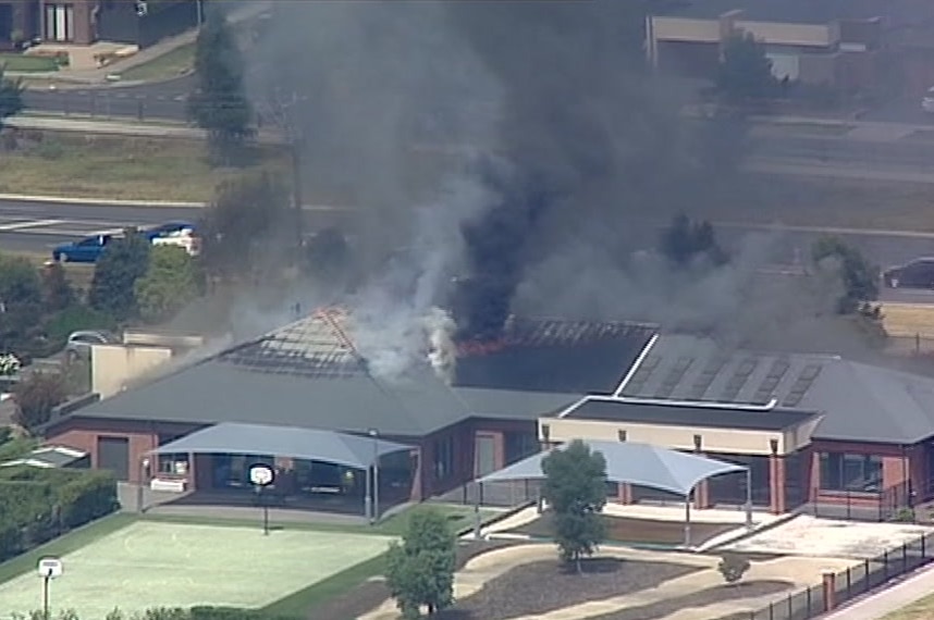 Aerials image of smoke billowing from the roof of a Cranbourne East retirement home.
