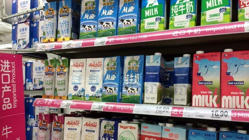 Imported long life milk stacked in a supermarket shelf