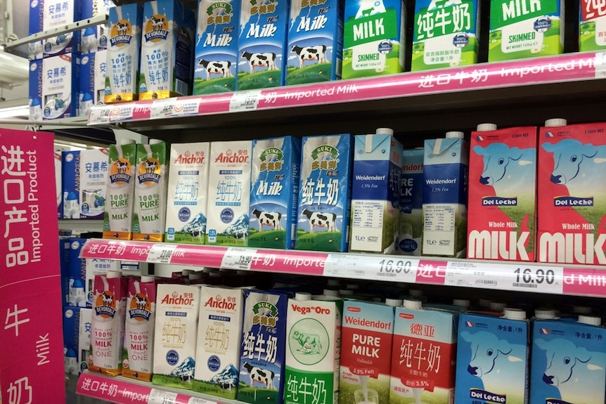 Imported long life milk stacked in a supermarket shelf