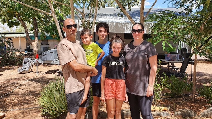 Emma Kariotis, right, with her brother-in-law Joe and his children Matteo, Dimitri and Ana outside a caravan.