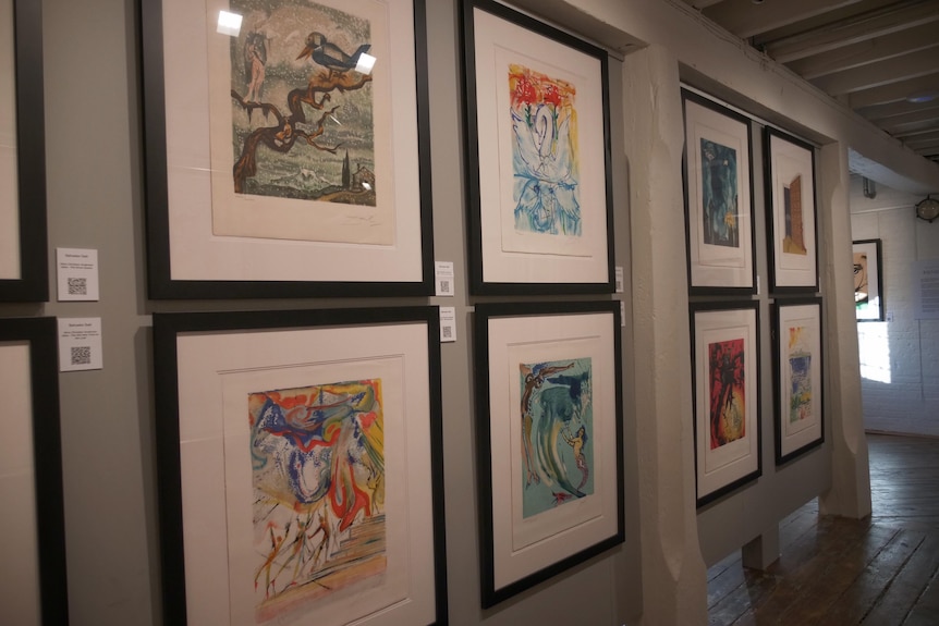 An art gallery wall with framed prints