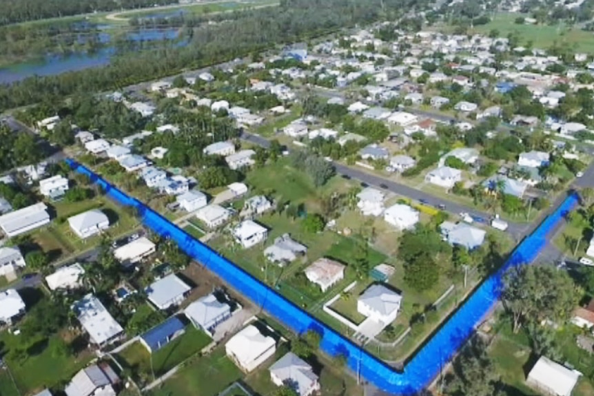 Temporary flood levee in the Rockhampton suburb of Berserker, as seen from the air