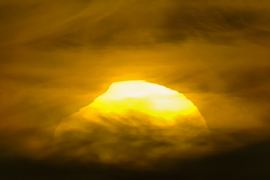 A 2021 partial eclipse at sunset
