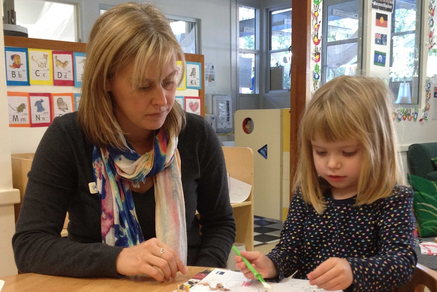 Childcare worker Karly Hadenfeldt with a student