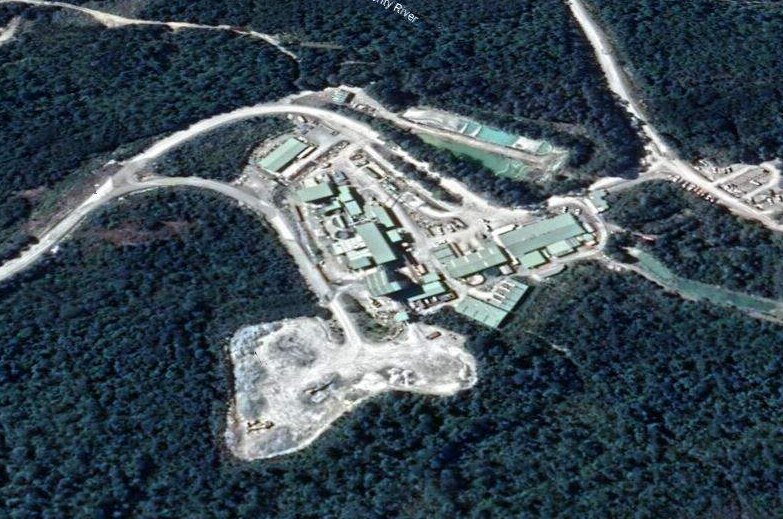 A satellite picture of the Henty Gold Mine showing white and light green structures amid greenery