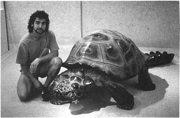 A man with a big turtle 