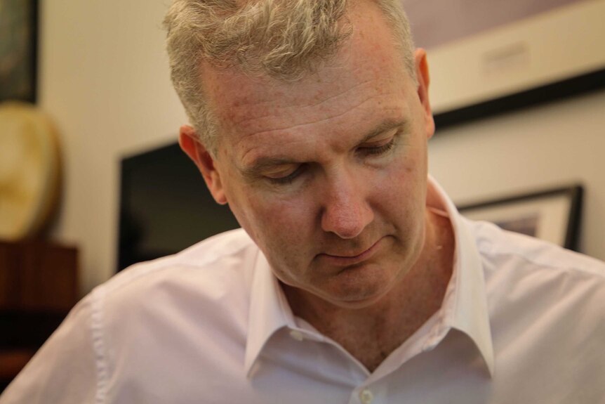 Tony Burke plays his favourite guitar in his Parliament House office.