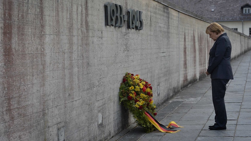 German chancellor Angela Merkel pays her respects at Dachau memorial