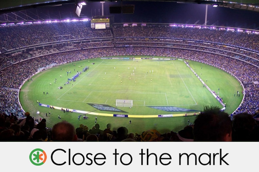 Rain falls on the MCG. Covers are on the pitch. "Close to the mark" is overlaid on the bottom of picture.