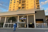 A police forensic officer outside the Oaks apartments