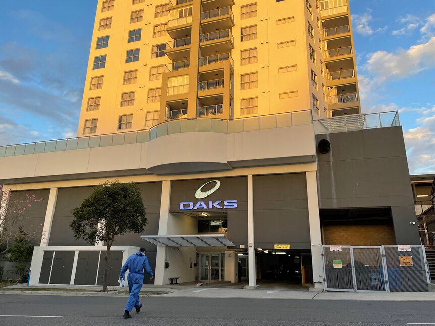 A police forensic officer outside the Oaks apartments