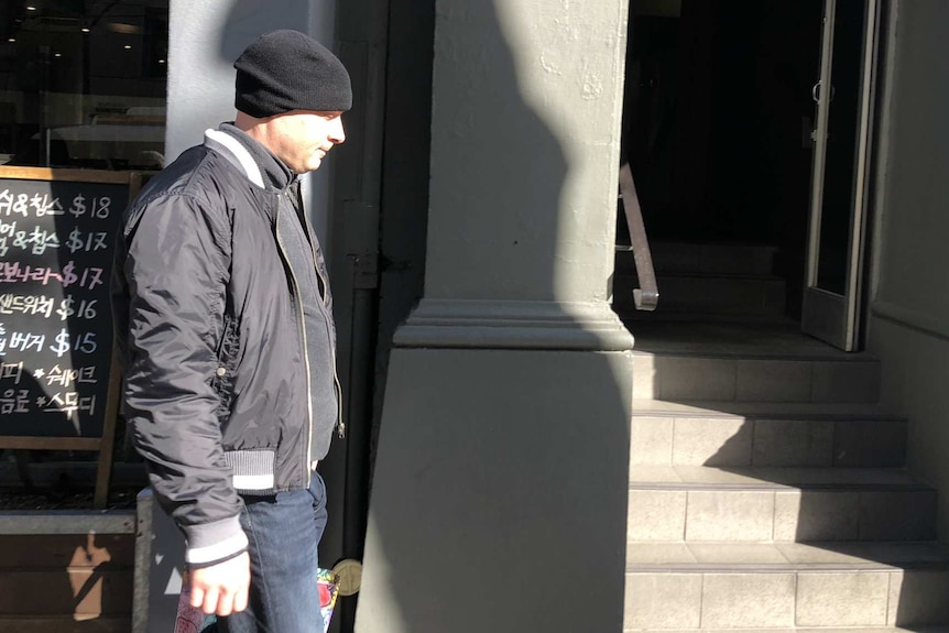 Glenn Golfis walks on the street near Melbourne Magistrates' Court.