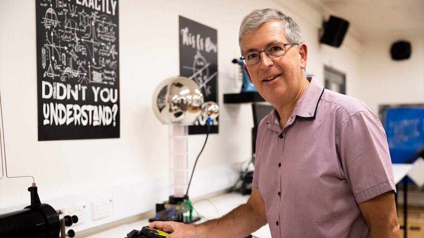 Associate professor Nigel Marks holds a Geiger counter. 