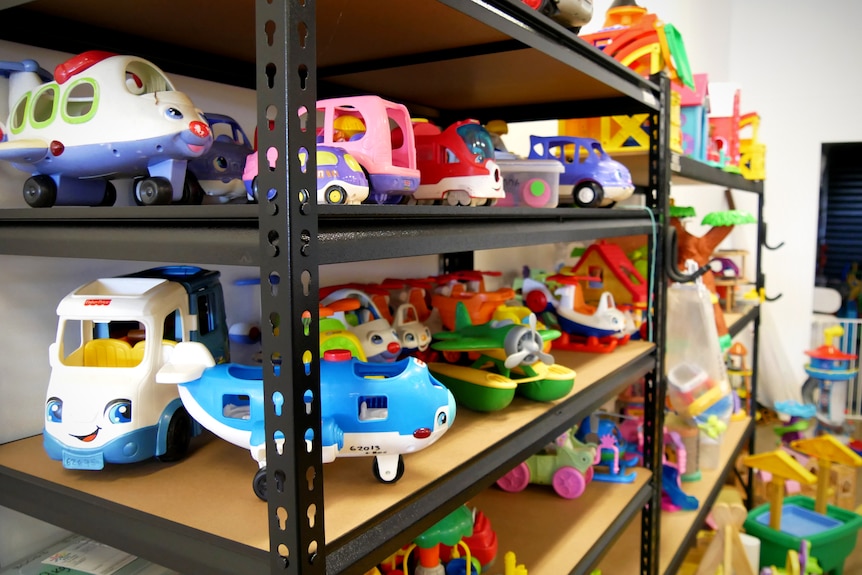 A shelf of colourful children's toys 