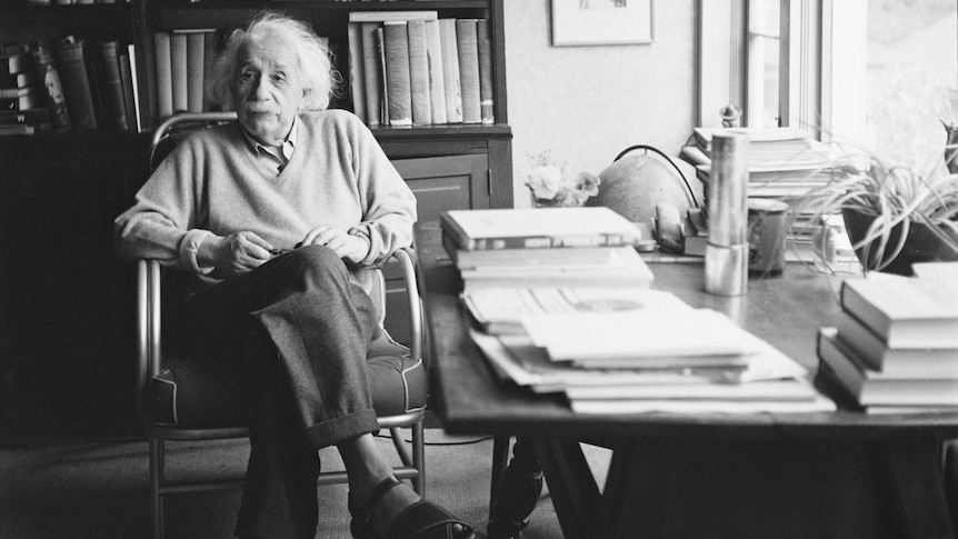 Albert Einstein at desk