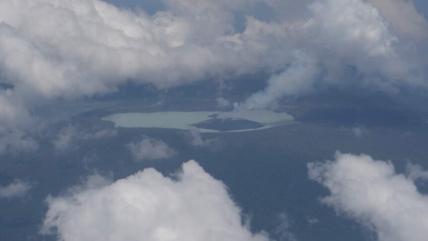 A photograph taken from an aircraft shows smoke billowing from the Monaro volcano.