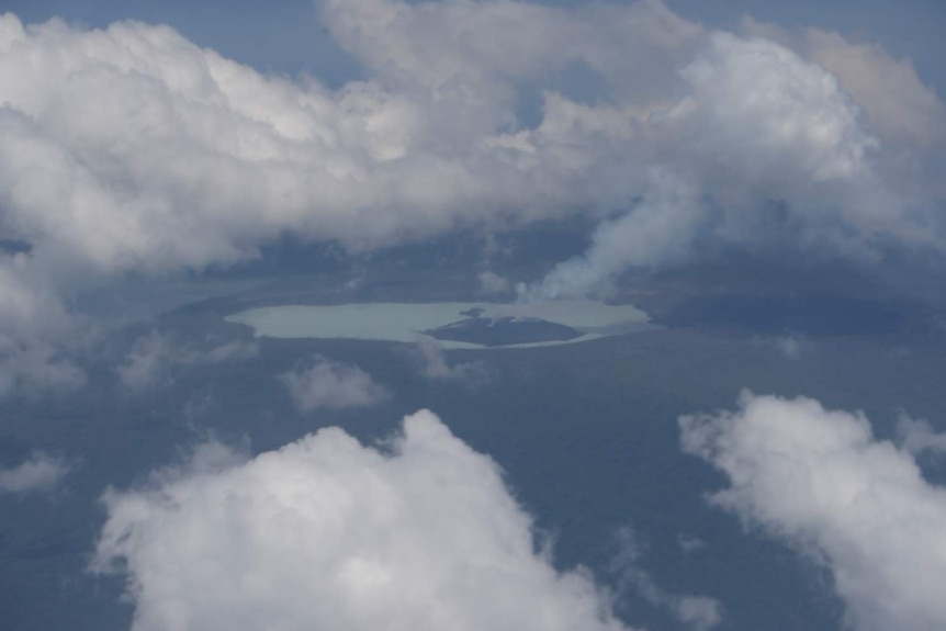 A photograph taken from an aircraft shows smoke billowing from the Monaro volcano.